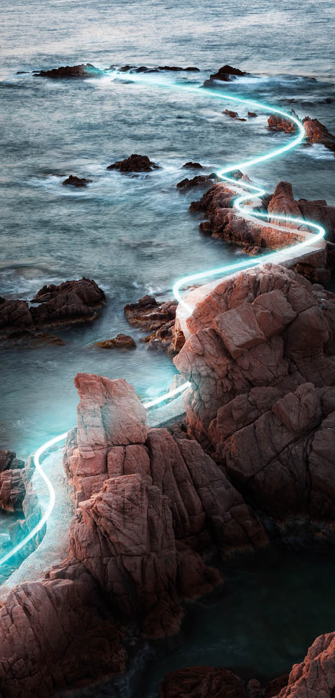 Light painting between the rock formations in the Costa Brava coastline.